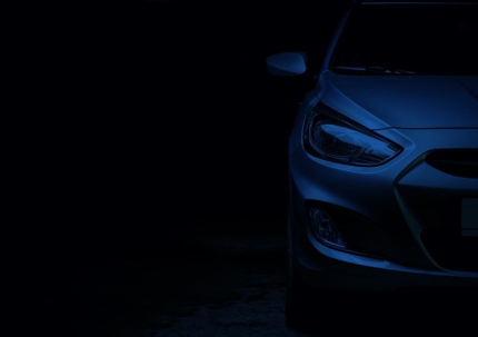blue car in dark room